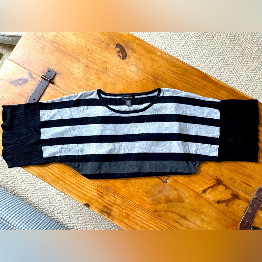 Spence sweater with side buttons.